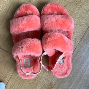 Ugg slippers, women's size 8, color tan or coral, lightly used